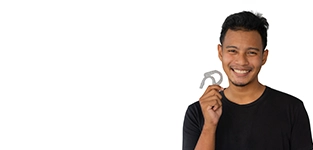 Man smiling holding clear dental aligners